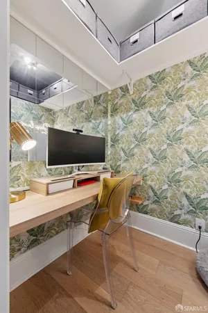 a living room with a flat screen tv and painted walls