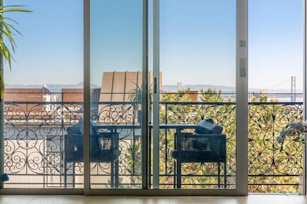 a view of a balcony with chairs
