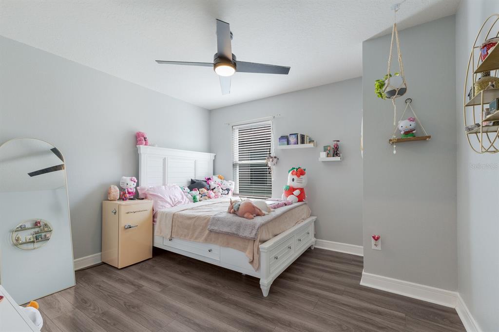 8985 Royal River Circle Parrish, FL 34219 - Photo 11 of 71 a bedroom with a bed and a chandelier