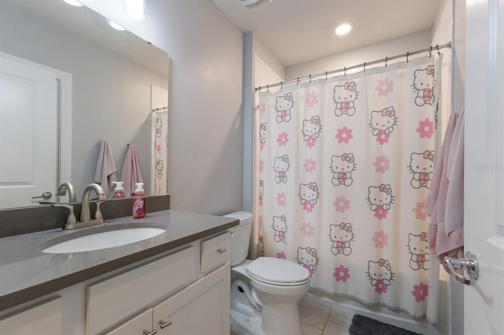 8985 Royal River Circle Parrish, FL 34219 - Photo 12 of 71 a bathroom with a granite countertop sink toilet and shower