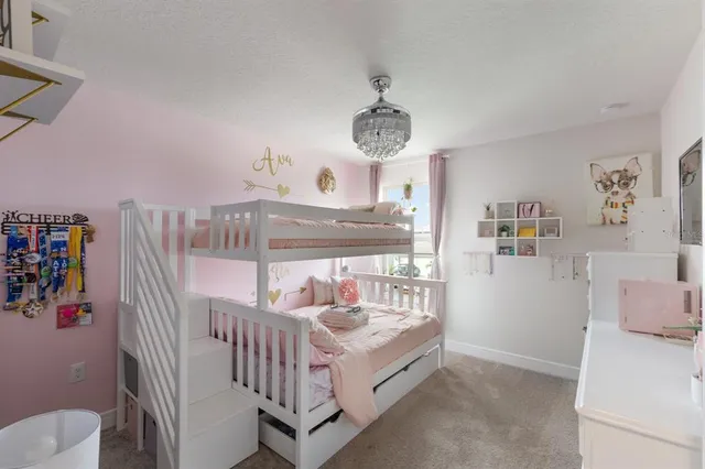 a bathroom with a double vanity sink mirror and toilet