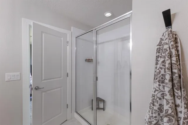 a aerial view of a house with a yard and potted plants