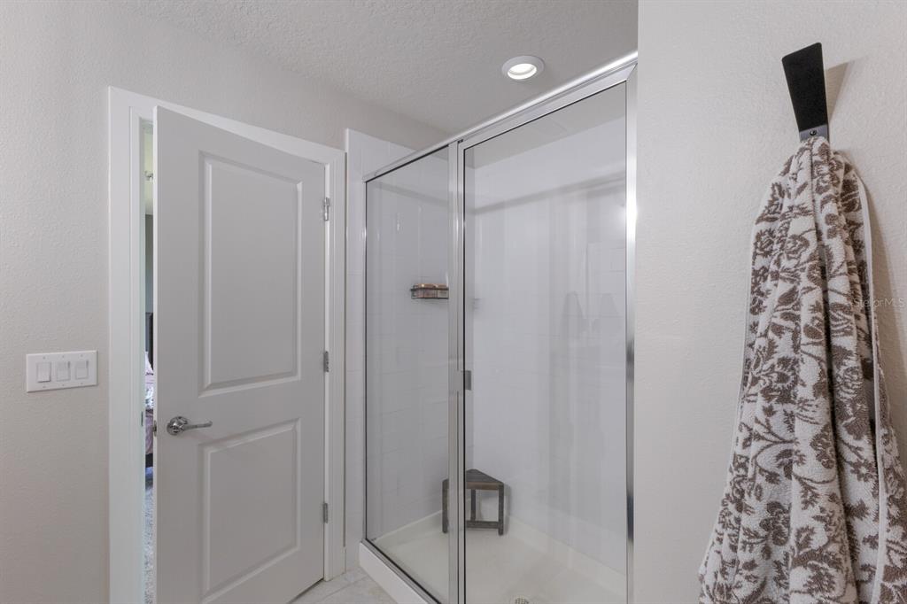 8985 Royal River Circle Parrish, FL 34219 - Photo 22 of 71 a bathroom with a shower and a mirror