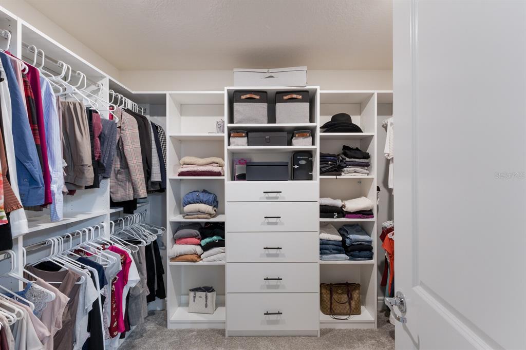 8985 Royal River Circle Parrish, FL 34219 - Photo 23 of 71 a view of walk in closet with clothes and shoes