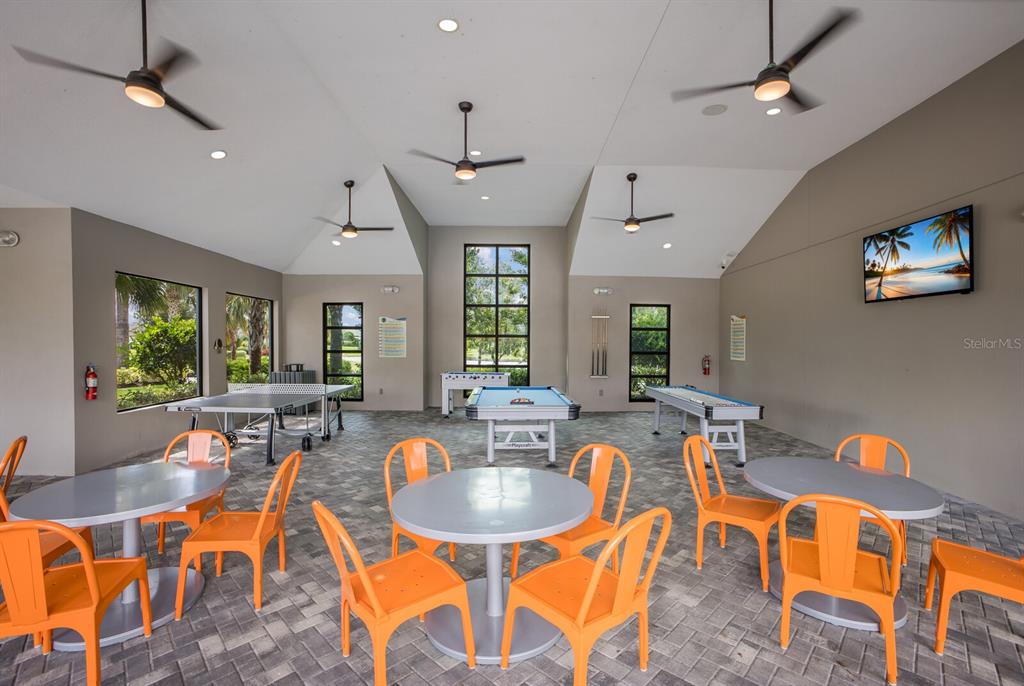 8985 Royal River Circle Parrish, FL 34219 - Photo 34 of 71 a dining room with furniture a window and wooden floor
