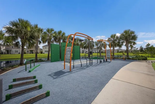 a living room with patio furniture and a large window