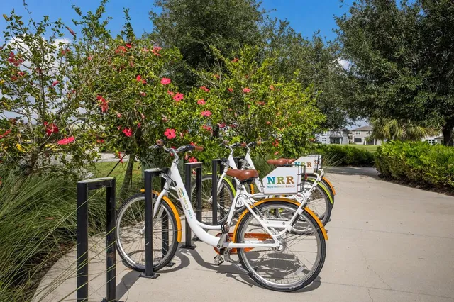 a large kitchen with stainless steel appliances granite countertop a refrigerator and stove