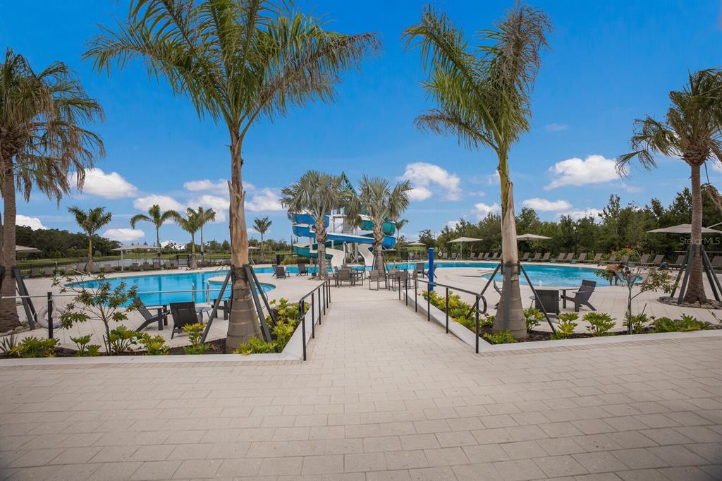 8985 Royal River Circle Parrish, FL 34219 - Photo 46 of 71 a view of a swimming pool with a table and chairs
