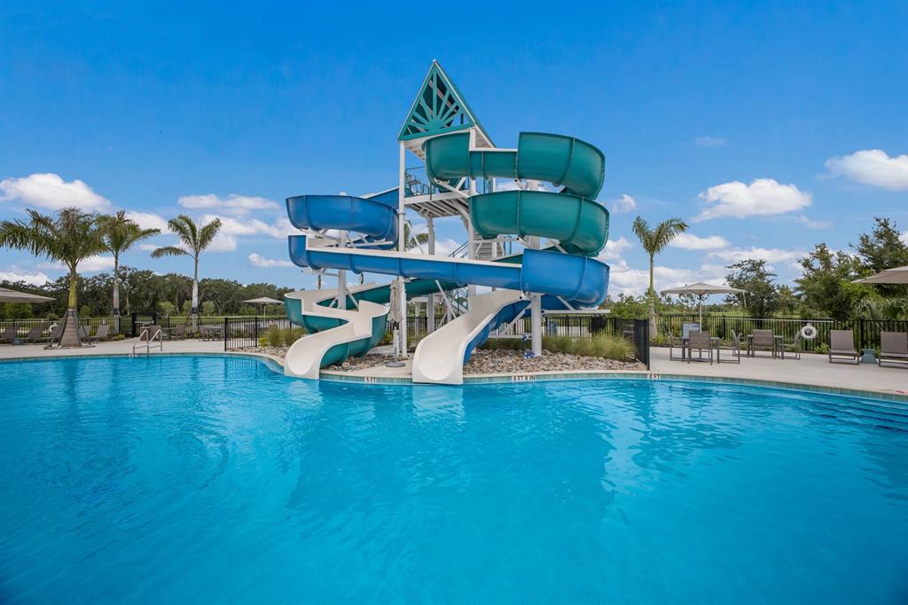 8985 Royal River Circle Parrish, FL 34219 - Photo 47 of 71 a view of a swimming pool with lawn chairs