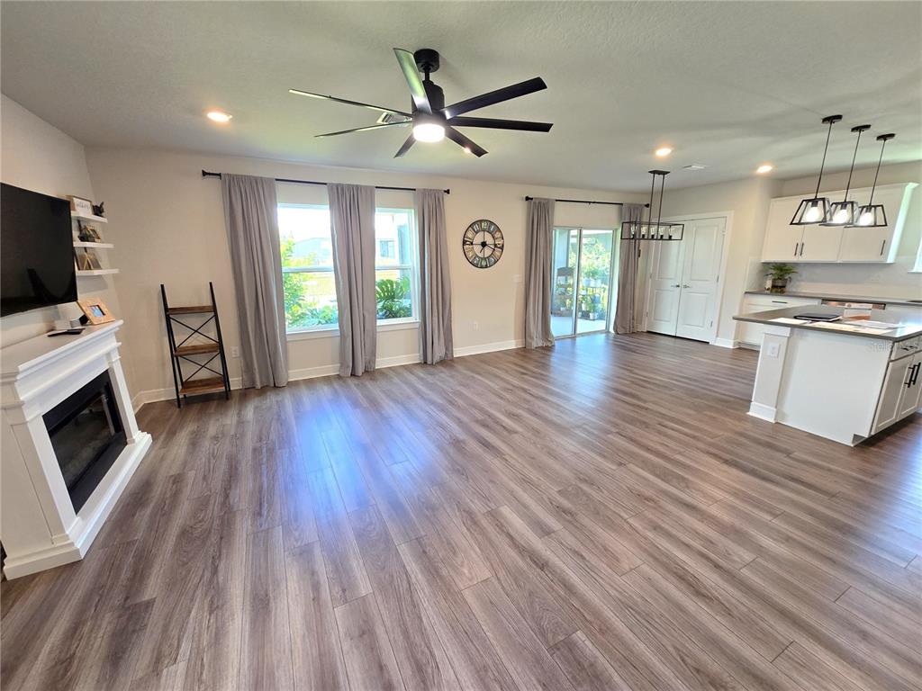8985 Royal River Circle Parrish, FL 34219 - Photo 5 of 71 a view of a kitchen with a stove cabinets and wooden floor