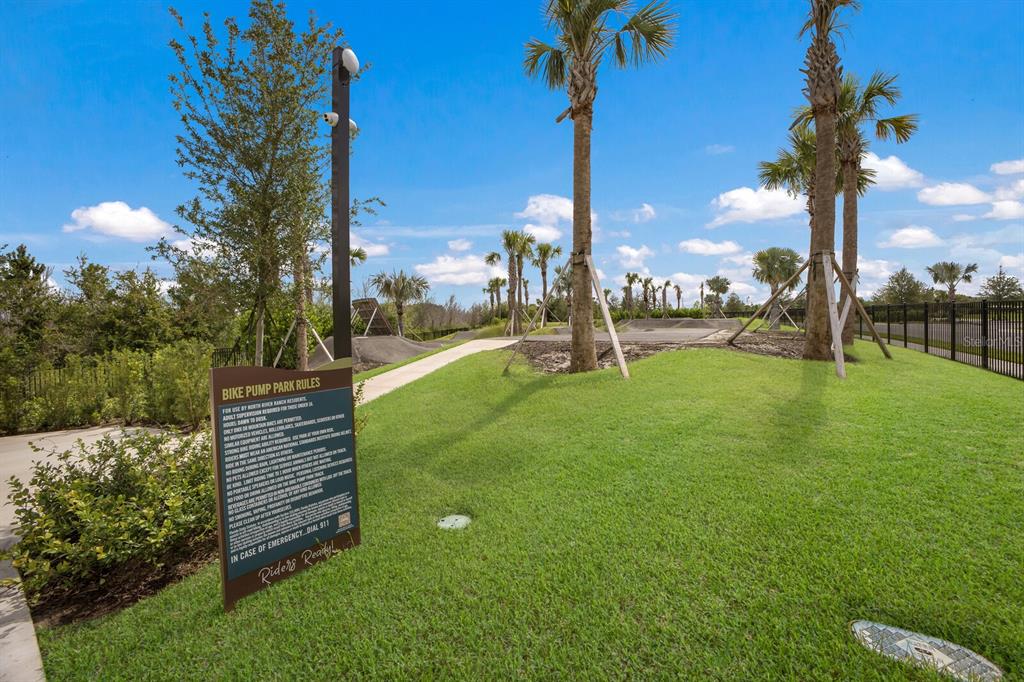 8985 Royal River Circle Parrish, FL 34219 - Photo 59 of 71 a park with lots of green space and palm trees