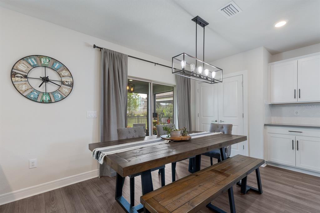 8985 Royal River Circle Parrish, FL 34219 - Photo 10 of 71 a view of a dining room with furniture window and wooden floor