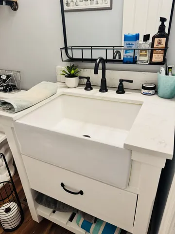a bathroom with a sink and a mirror