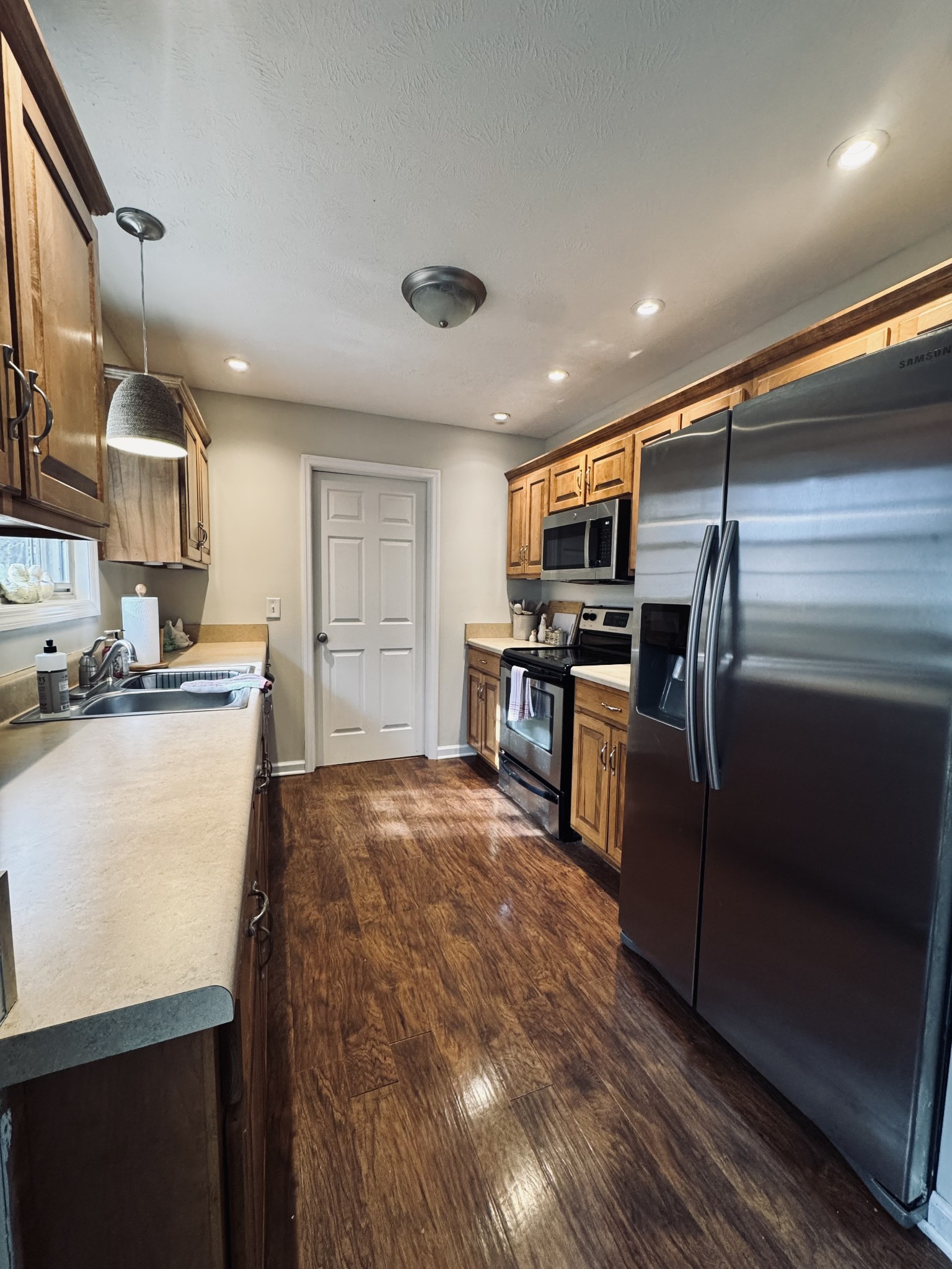 120 Skyview Drive Carthage, TN 37030 - Photo 10 of 30 a kitchen with stainless steel appliances granite countertop a refrigerator and a stove