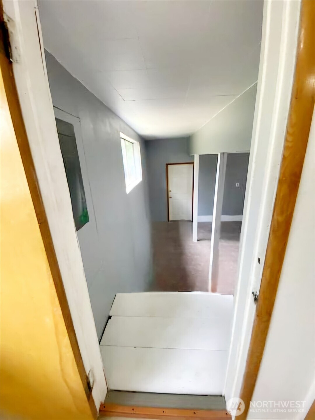 55 Church Road McCleary, WA 98557 - Photo 26 of 40 a view of an empty room with wooden floor and door