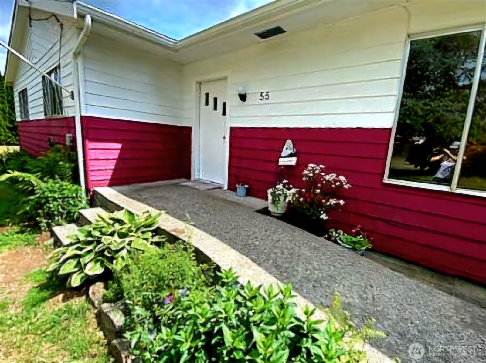 55 Church Road McCleary, WA 98557 - Photo 3 of 40 a view of a house with a flower garden