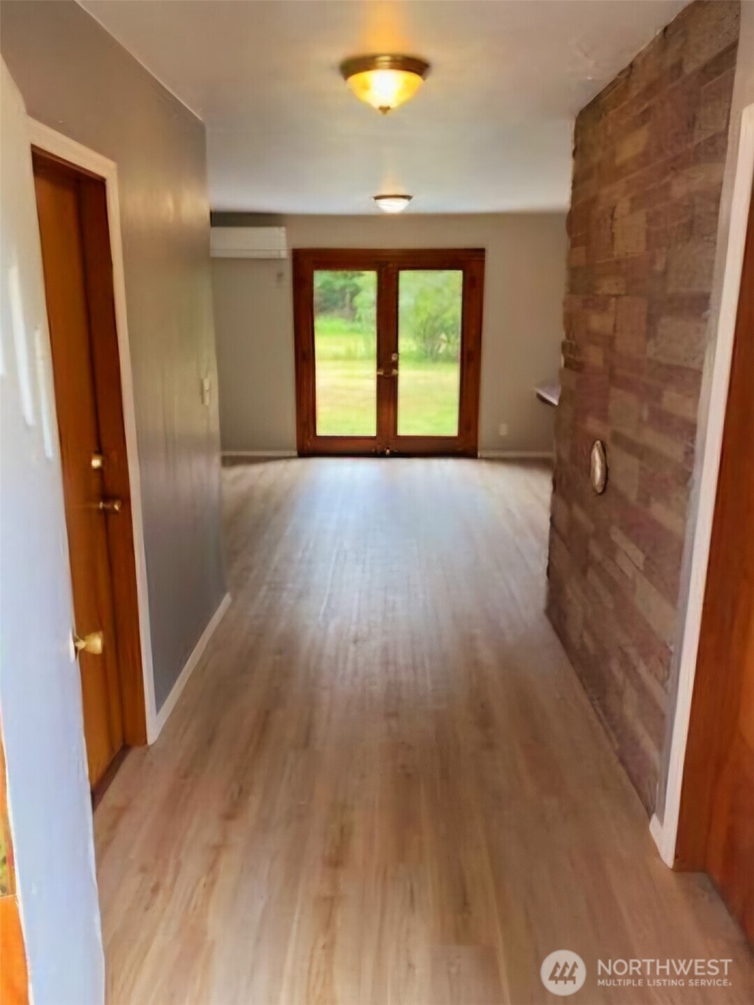 55 Church Road McCleary, WA 98557 - Photo 10 of 40 wooden floor in an empty room with a window