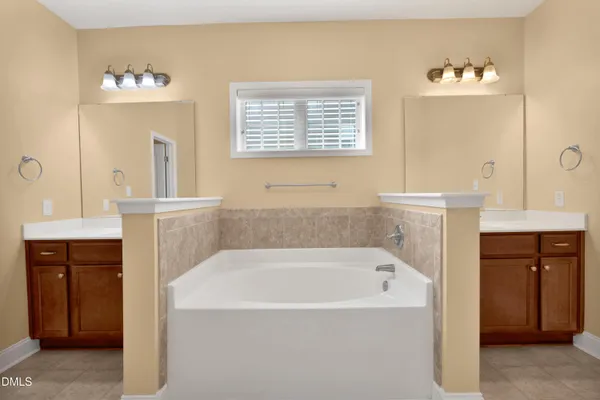 a bathroom with a bathtub and a sink