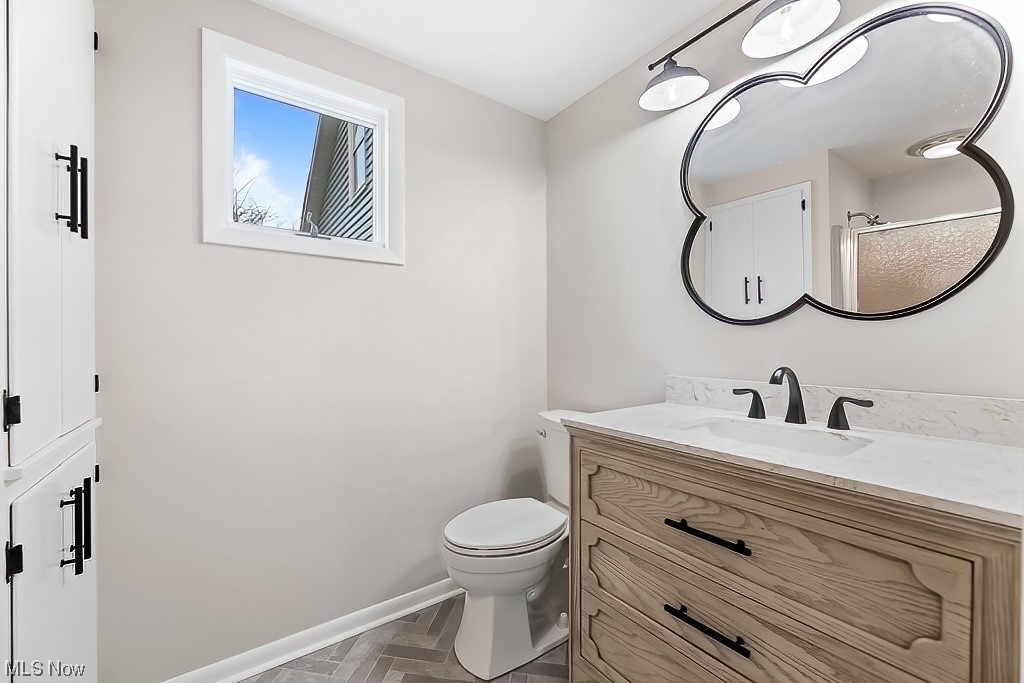 22121 Buck Road Alliance, OH 44601 - Photo 29 of 34 Bathroom with toilet, parquet floors, and oversized vanity