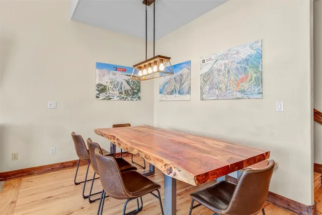 a dining room with a table and chairs