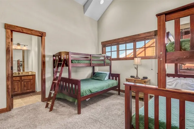 a bedroom with furniture and a window