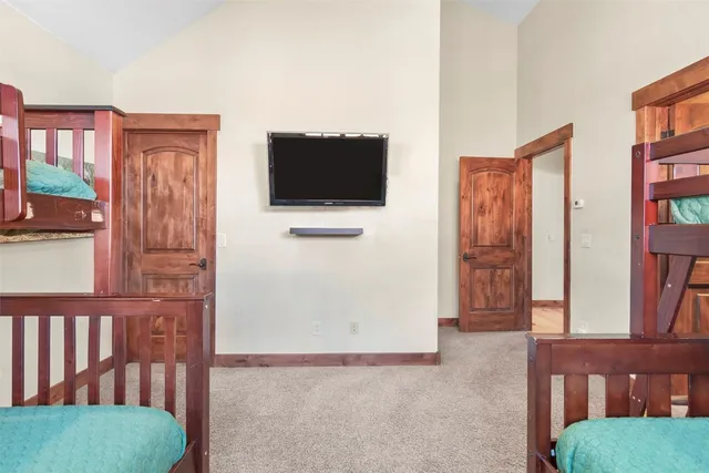 a view of a livingroom with furniture and a flat screen tv