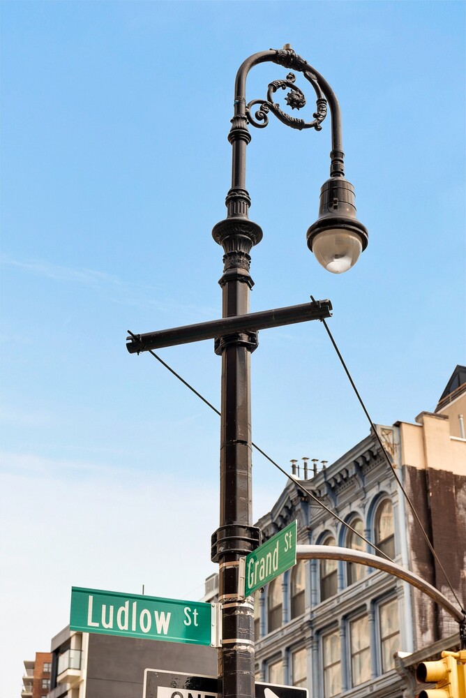 334 Grand Street, Unit PH Manhattan, NY 10002 - Photo 13 of 14 a front view of a building with entryway