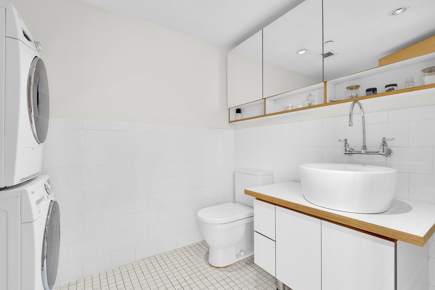 334 Grand Street, Unit PH Manhattan, NY 10002 - Photo 9 of 14 a bathroom with a sink and a toilet