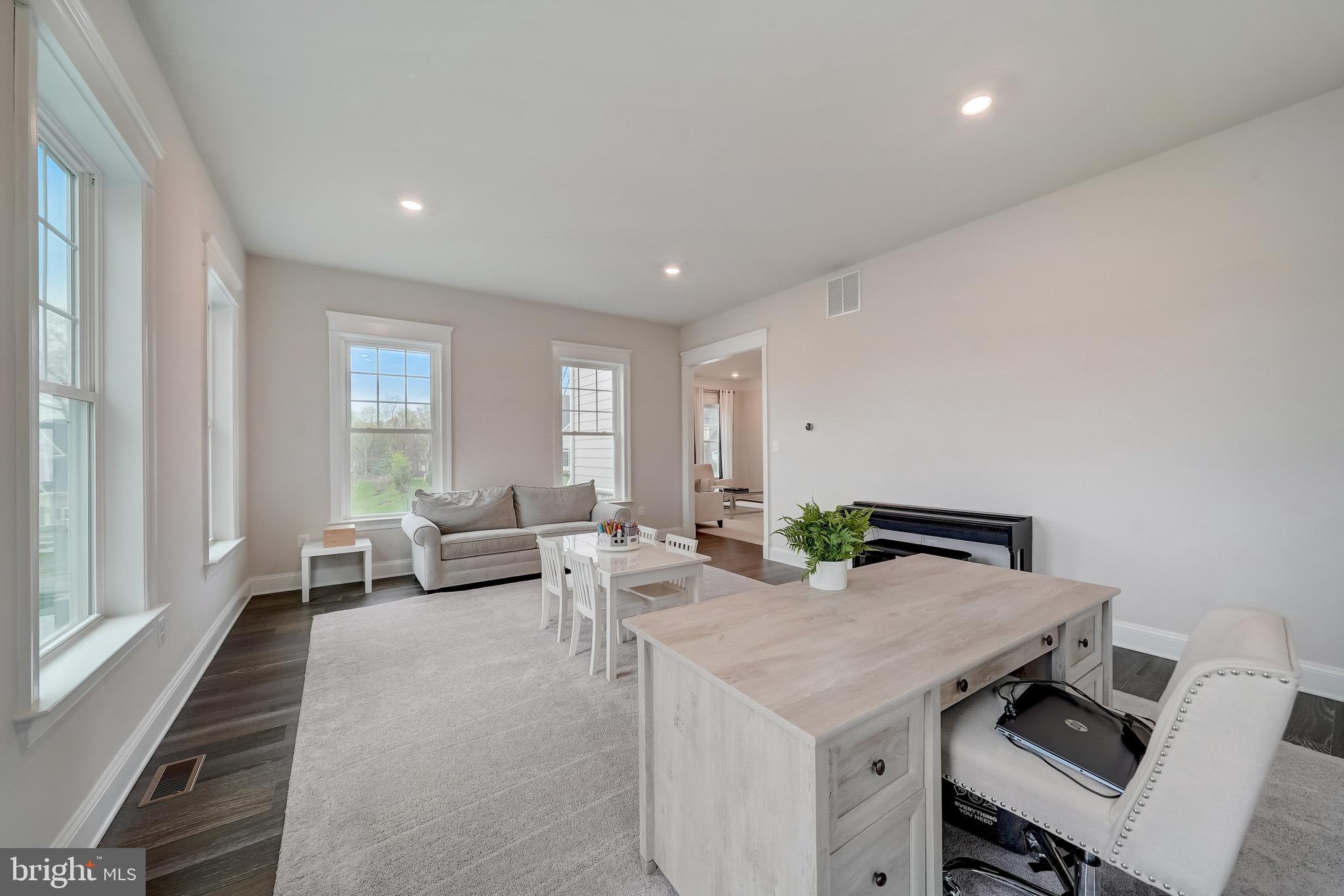 6 Gershwin Drive West Chester, PA 19380 - Photo 19 of 79 a living room with furniture and a window