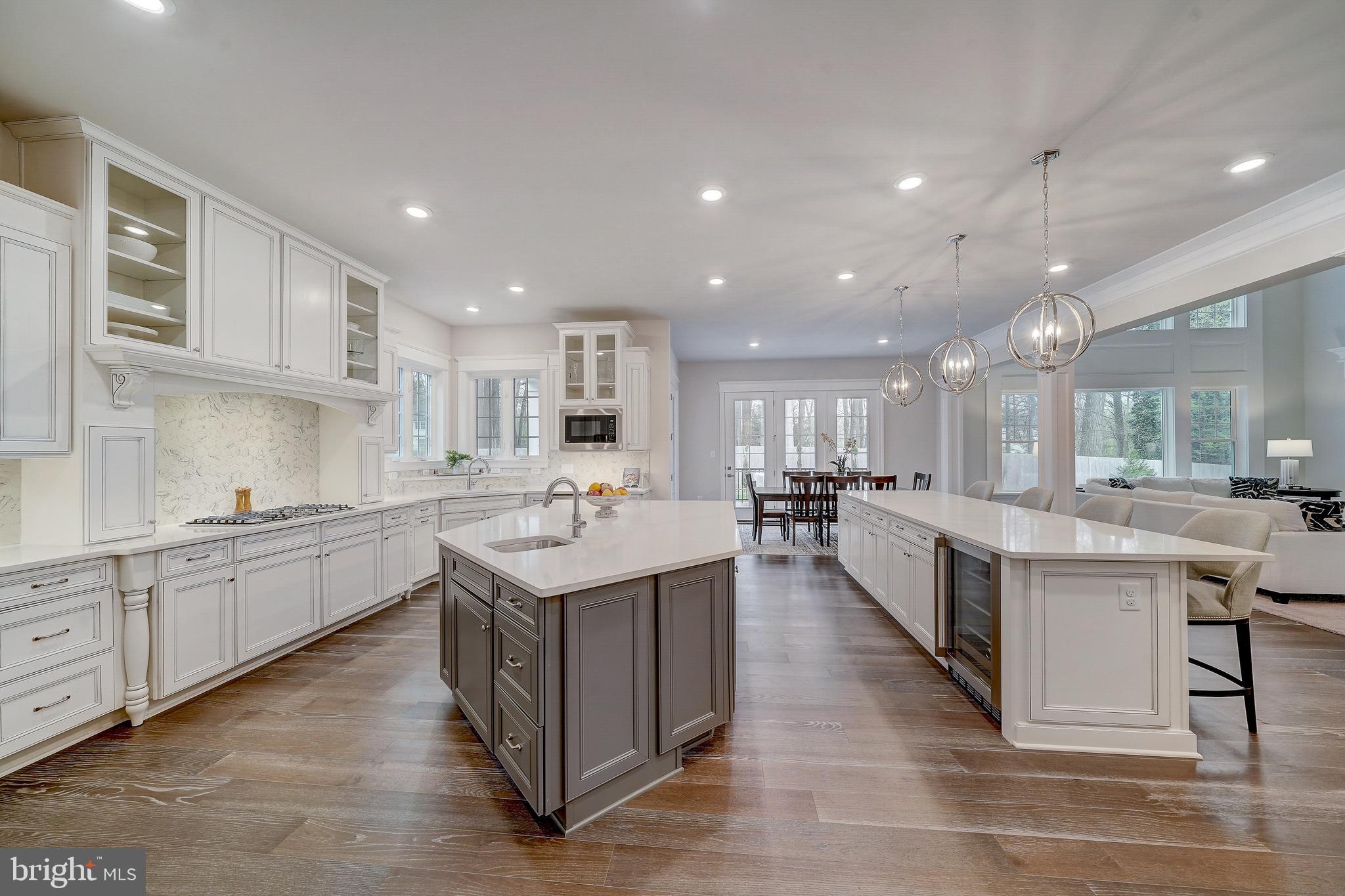 6 Gershwin Drive West Chester, PA 19380 - Photo 20 of 79 a large kitchen with kitchen island a sink white cabinets and appliances