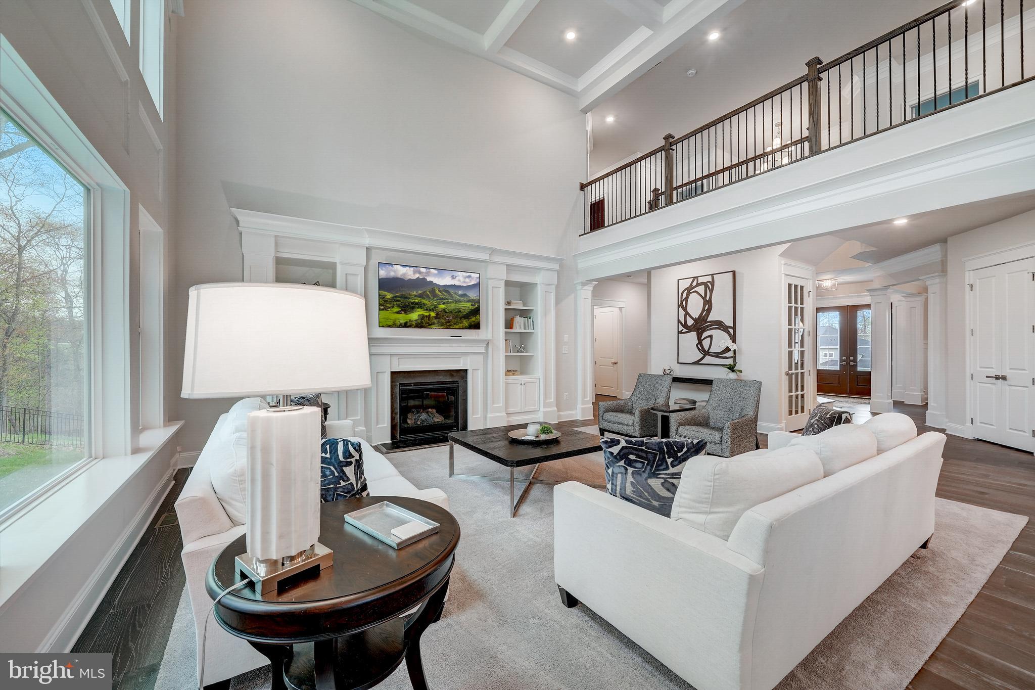 6 Gershwin Drive West Chester, PA 19380 - Photo 29 of 79 a living room with furniture a fireplace and a large window