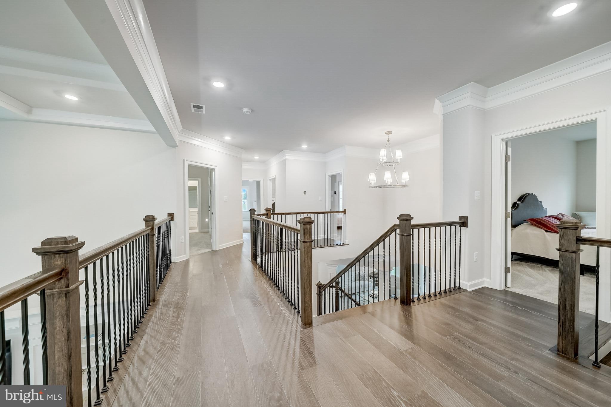 6 Gershwin Drive West Chester, PA 19380 - Photo 38 of 79 a view of a hallway with wooden floor and stairs