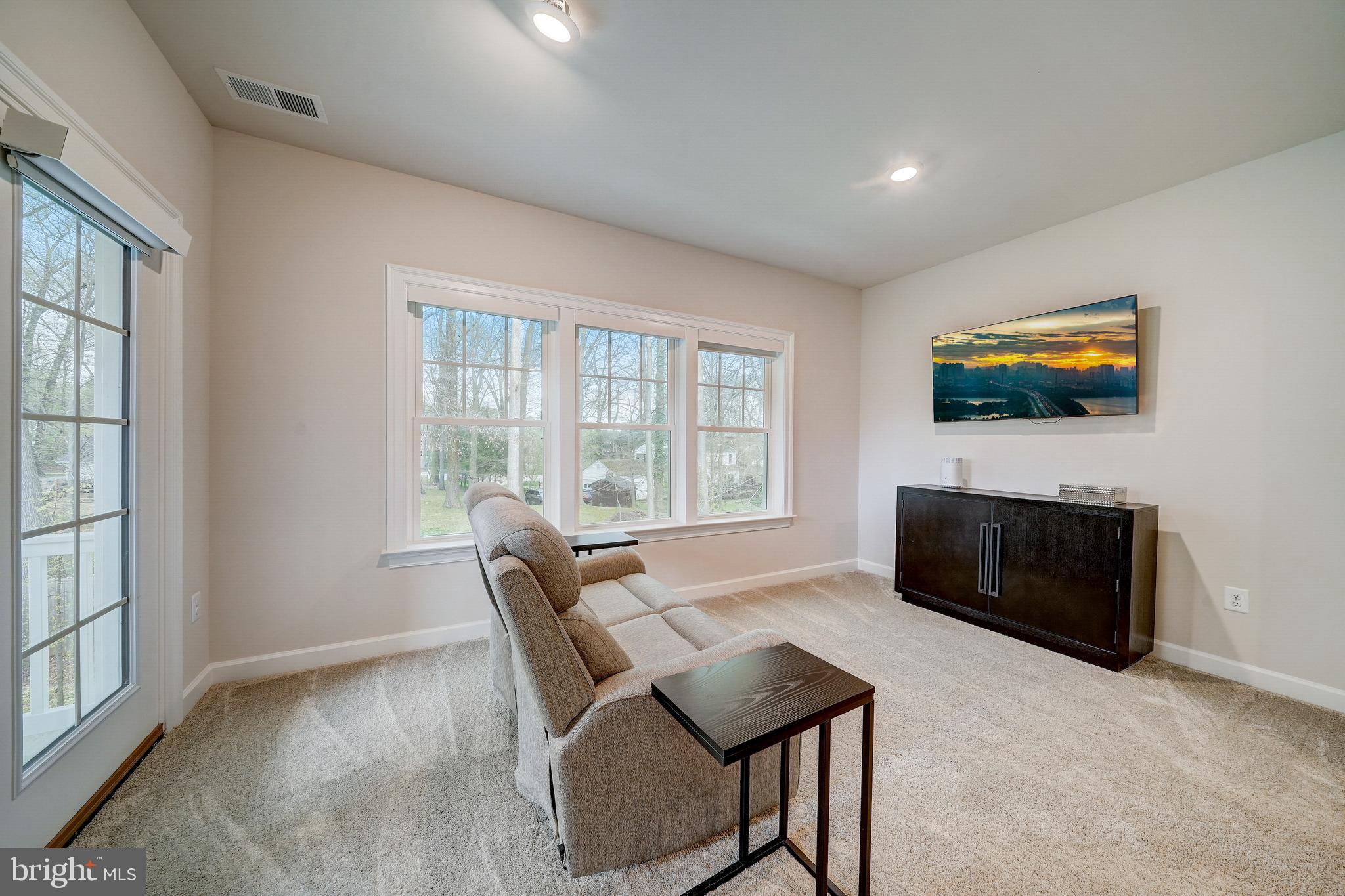 6 Gershwin Drive West Chester, PA 19380 - Photo 42 of 79 a living room with furniture and a flat screen tv