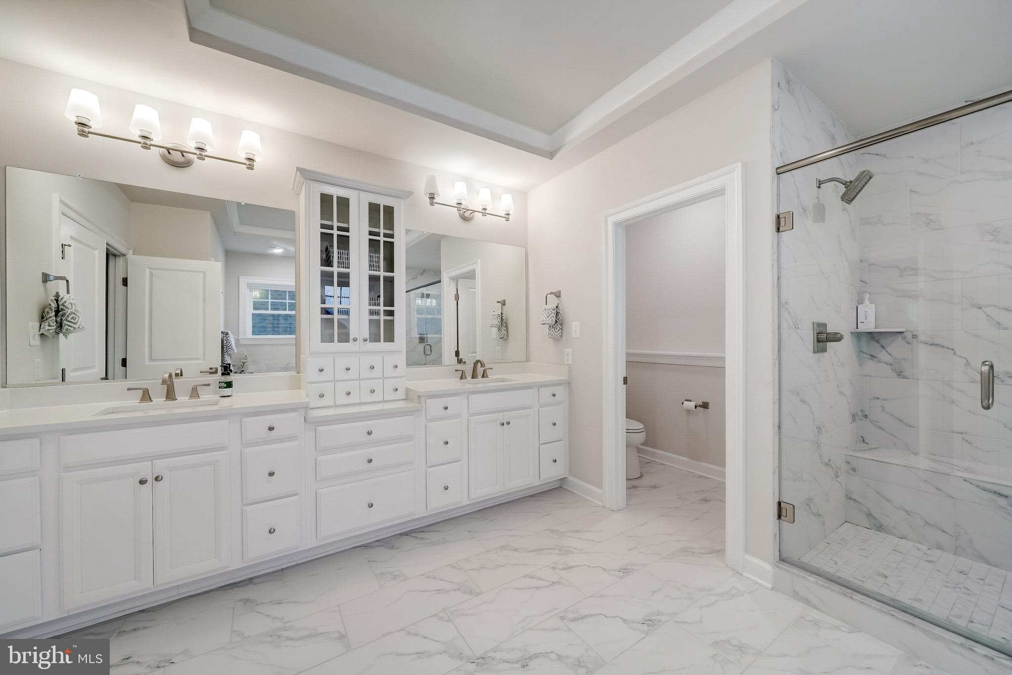 6 Gershwin Drive West Chester, PA 19380 - Photo 44 of 79 a spacious bathroom with a granite countertop sink mirror and shower