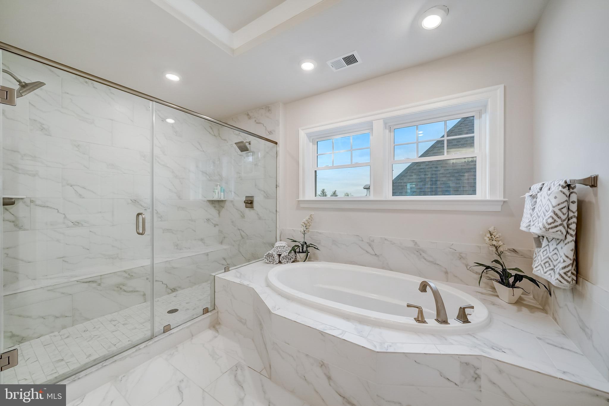 6 Gershwin Drive West Chester, PA 19380 - Photo 45 of 79 a bathroom with a tub sink and mirror