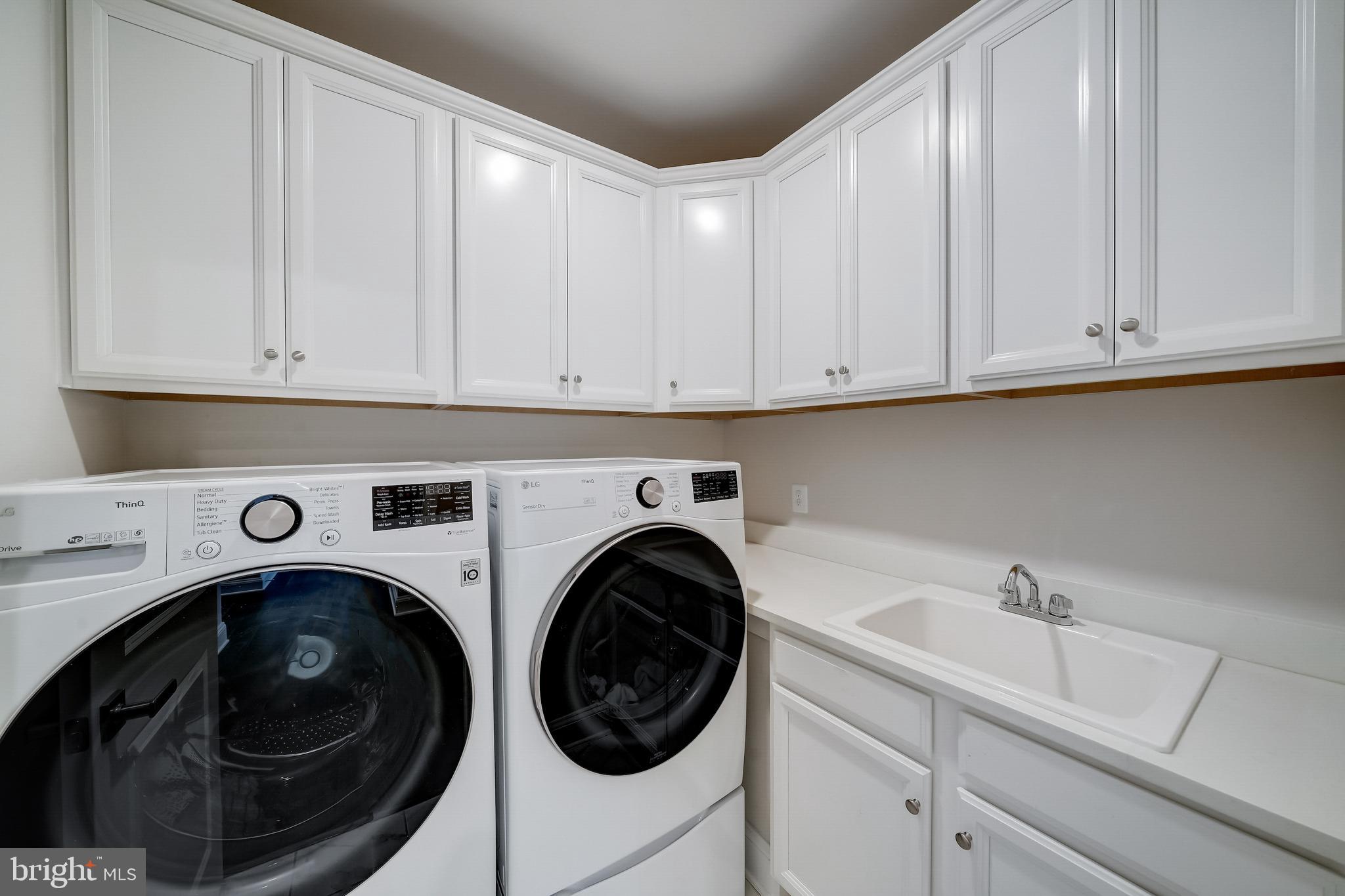 6 Gershwin Drive West Chester, PA 19380 - Photo 59 of 79 a utility room with sink dryer and washer
