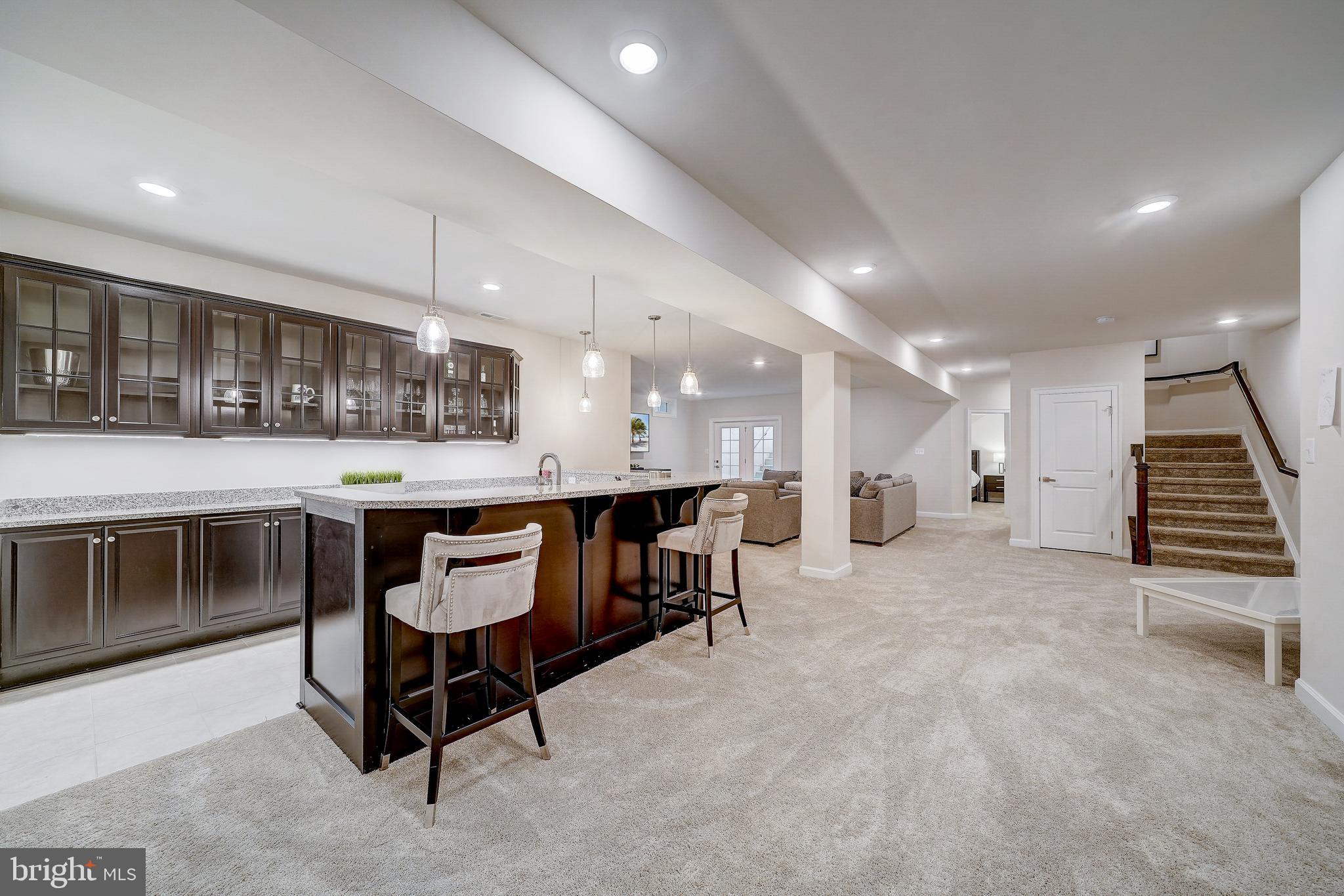 6 Gershwin Drive West Chester, PA 19380 - Photo 62 of 79 a living room with stainless steel appliances kitchen island granite countertop furniture and a kitchen view