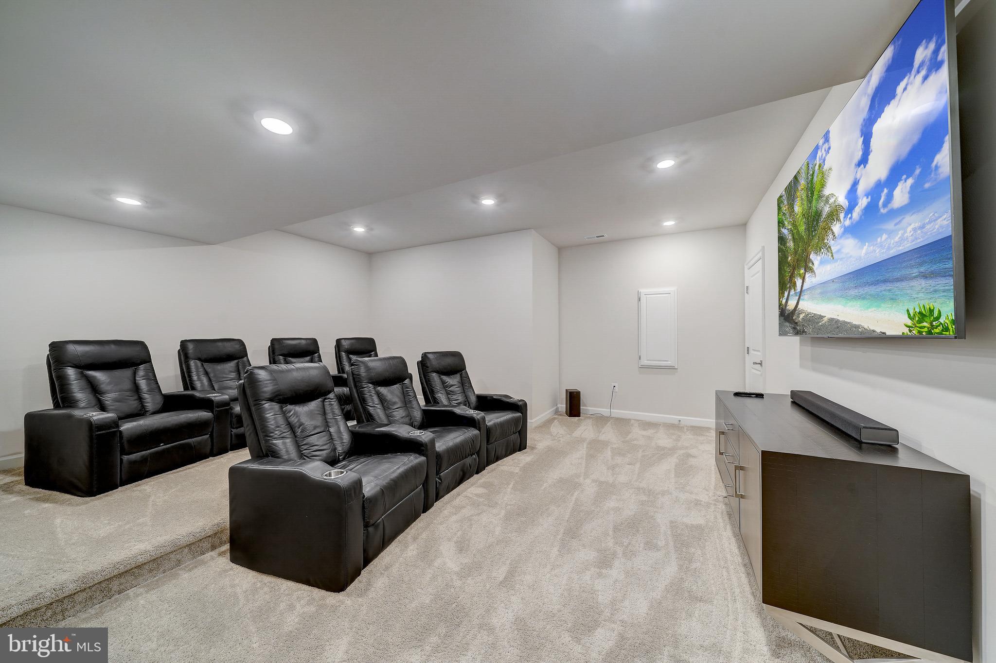 6 Gershwin Drive West Chester, PA 19380 - Photo 66 of 79 a living room with furniture a flat screen tv and a painting on the wall