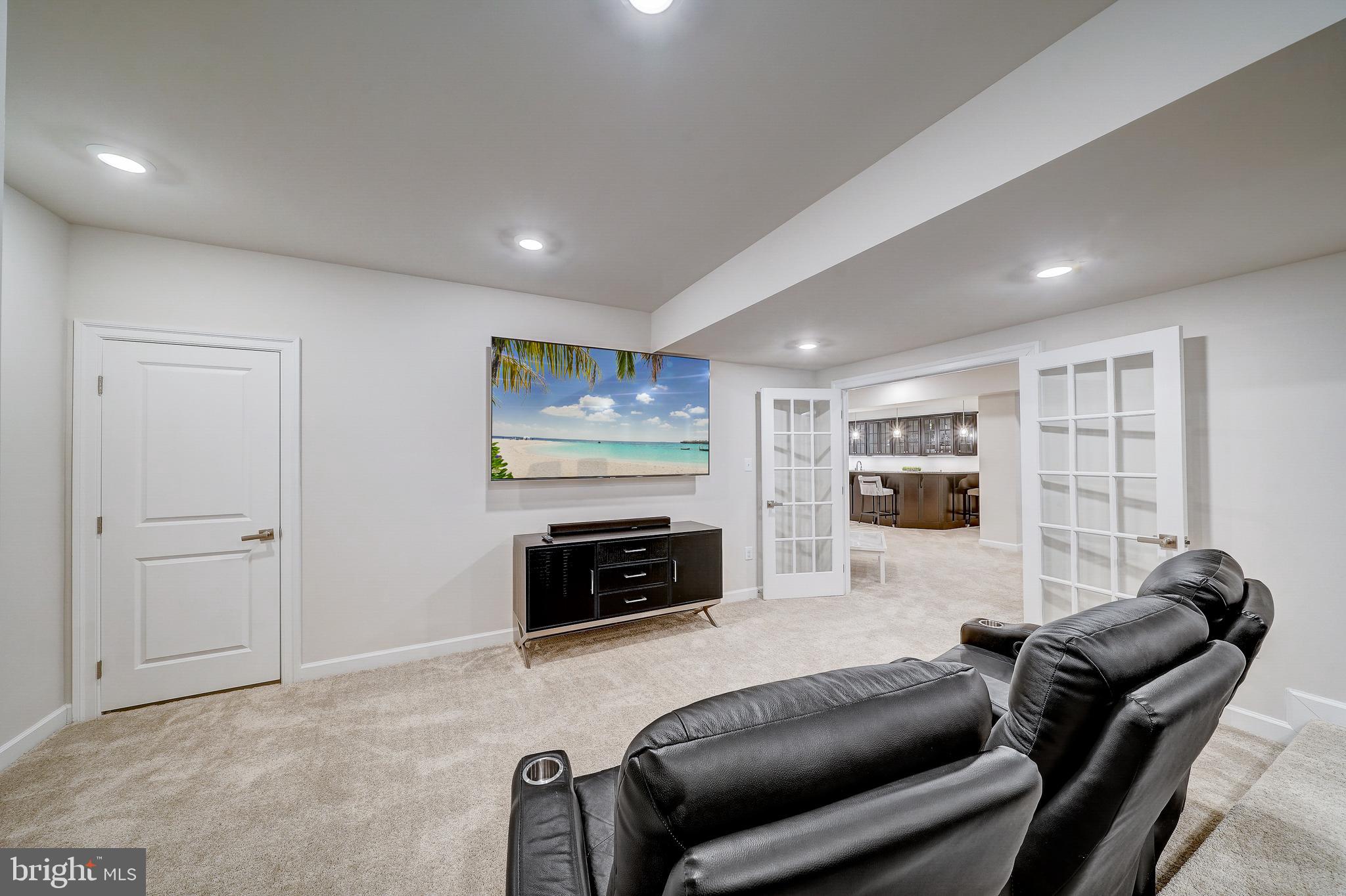 6 Gershwin Drive West Chester, PA 19380 - Photo 67 of 79 a living room with furniture and a flat screen tv