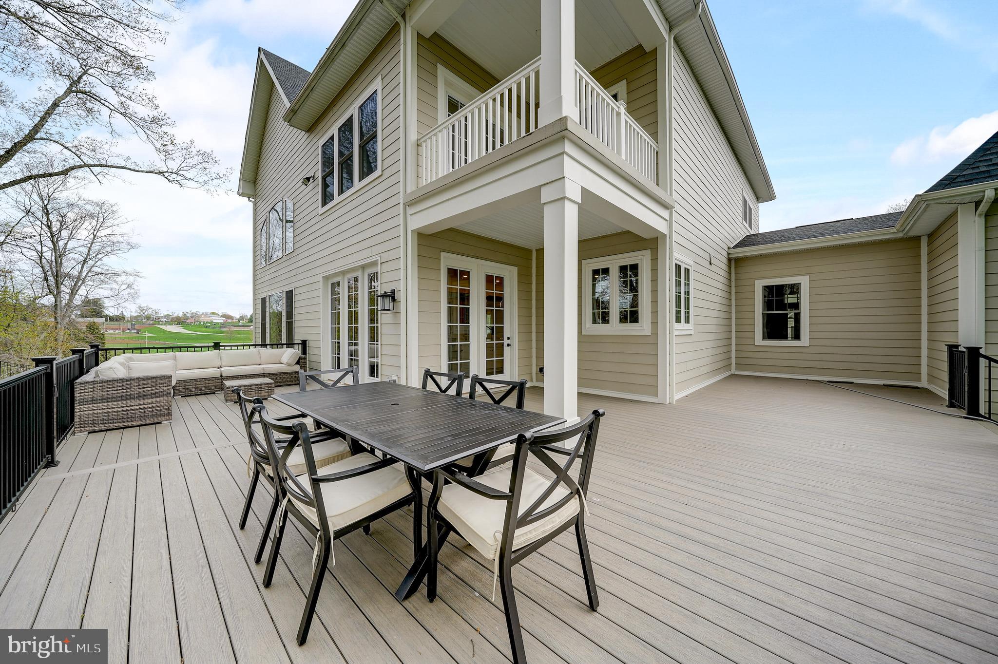 6 Gershwin Drive West Chester, PA 19380 - Photo 76 of 79 a view of a roof deck with table and chairs and wooden floor