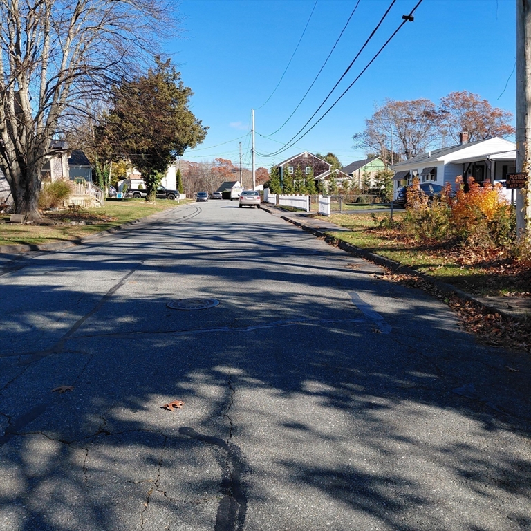 3.5 Golf Street Fairhaven, MA 02719 - Photo 9 of 10 a front view of a house with a yard