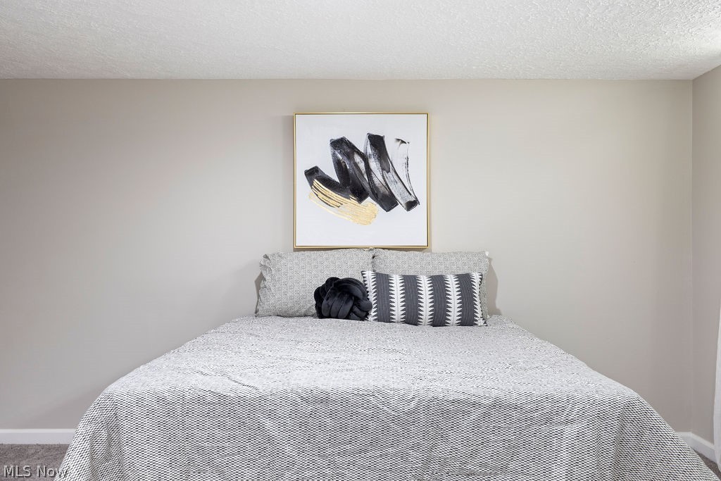 9620 David Road Garfield Heights, OH 44125 - Photo 27 of 36 Bedroom with a textured ceiling and carpet floors