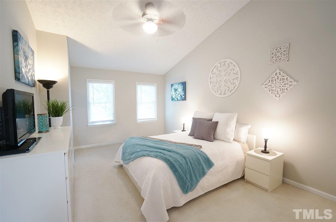 5401 Spring Pines Way Raleigh, NC 27616 - Photo 10 of 16 a bedroom with a bed and a tv