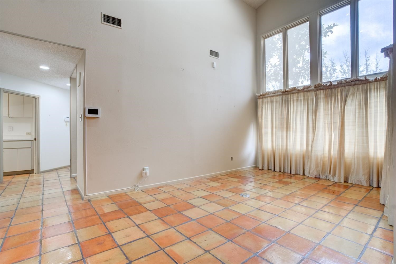 4902 92nd Street Lubbock, TX 79424 - Photo 13 of 44 a view of an empty room with window and wooden floor