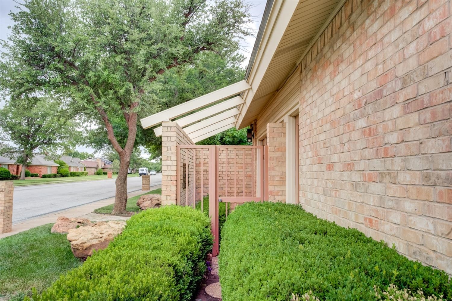 4902 92nd Street Lubbock, TX 79424 - Photo 4 of 44 a view of a back yard with a small cabin