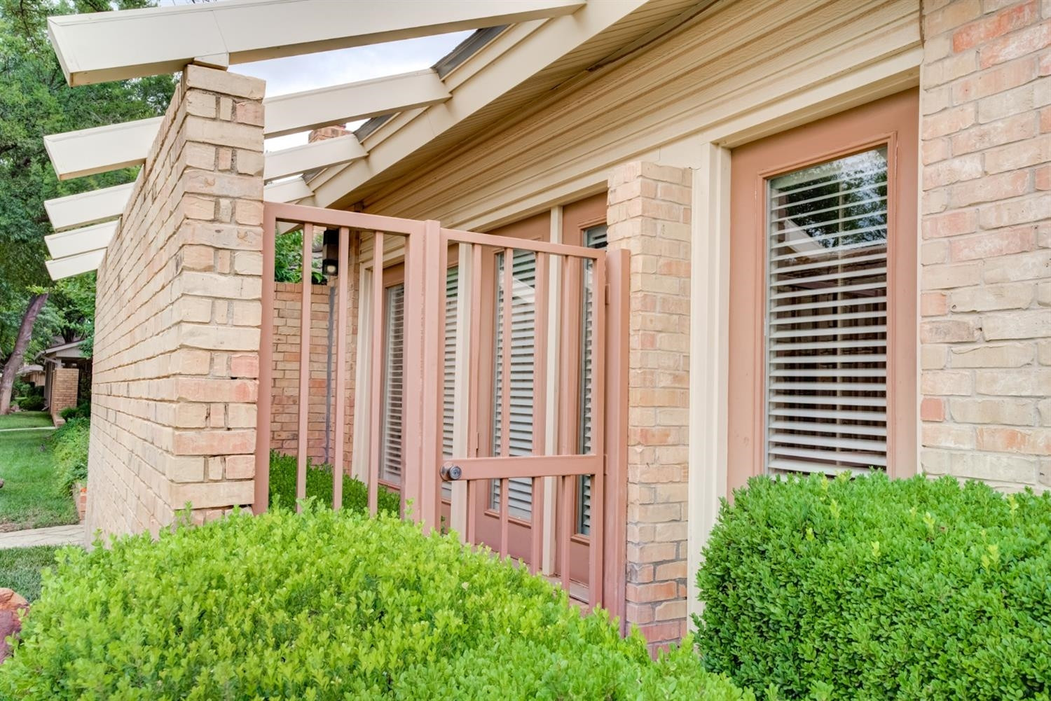 4902 92nd Street Lubbock, TX 79424 - Photo 5 of 44 a front view of a house with a garden