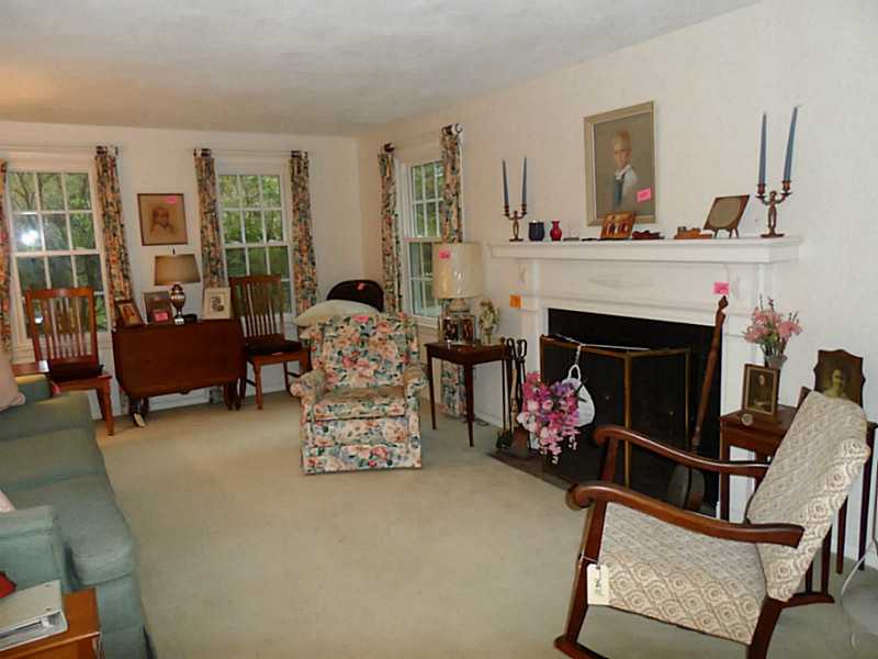 141 Timberline Road Warwick, RI 02886 - Photo 7 of 9 Living Room. The living room has hardwood floors and a wood burning fireplace