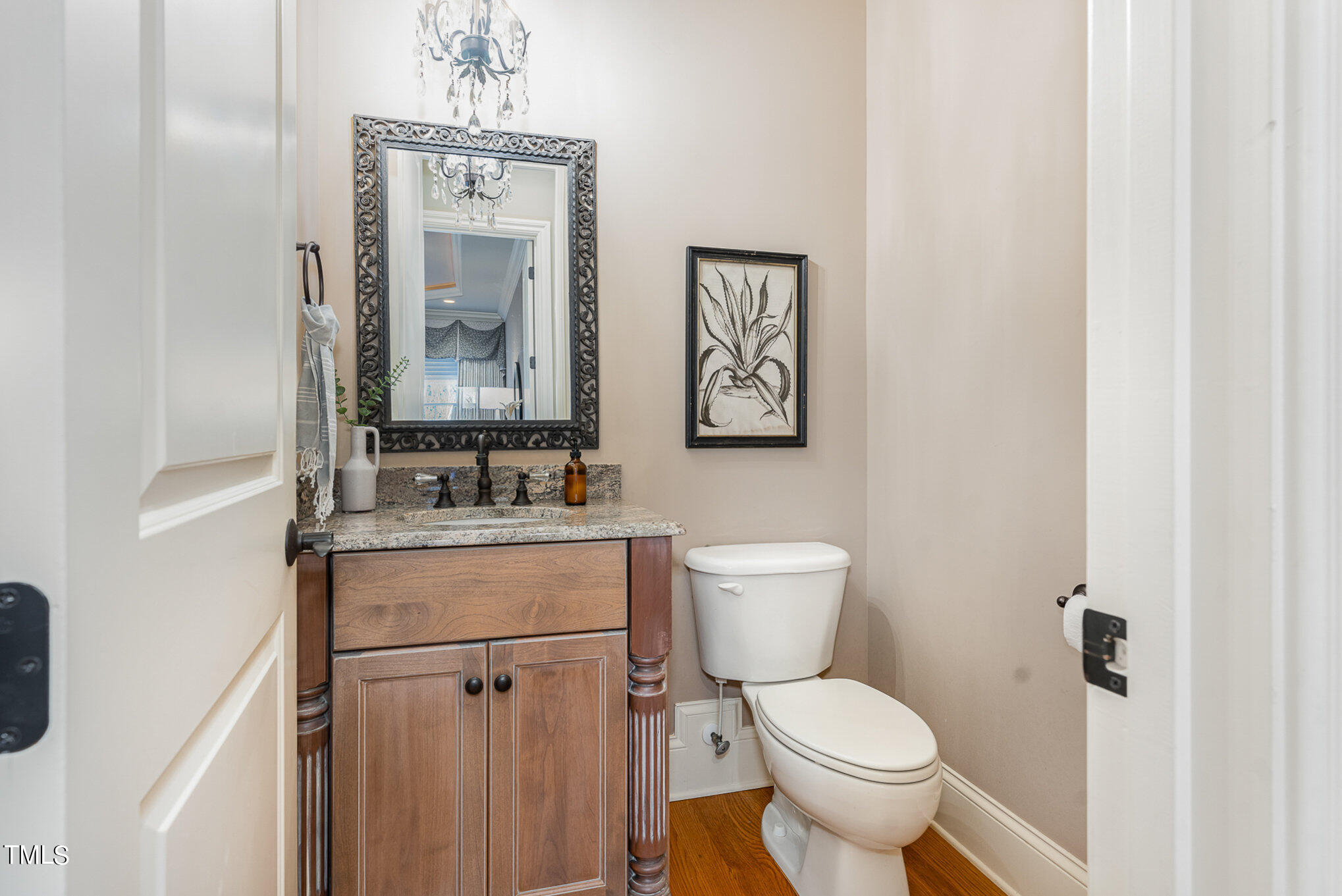 3028 Wyntree Ridge Way Raleigh, NC 27606 - Photo 12 of 39 a bathroom with a toilet sink and mirror