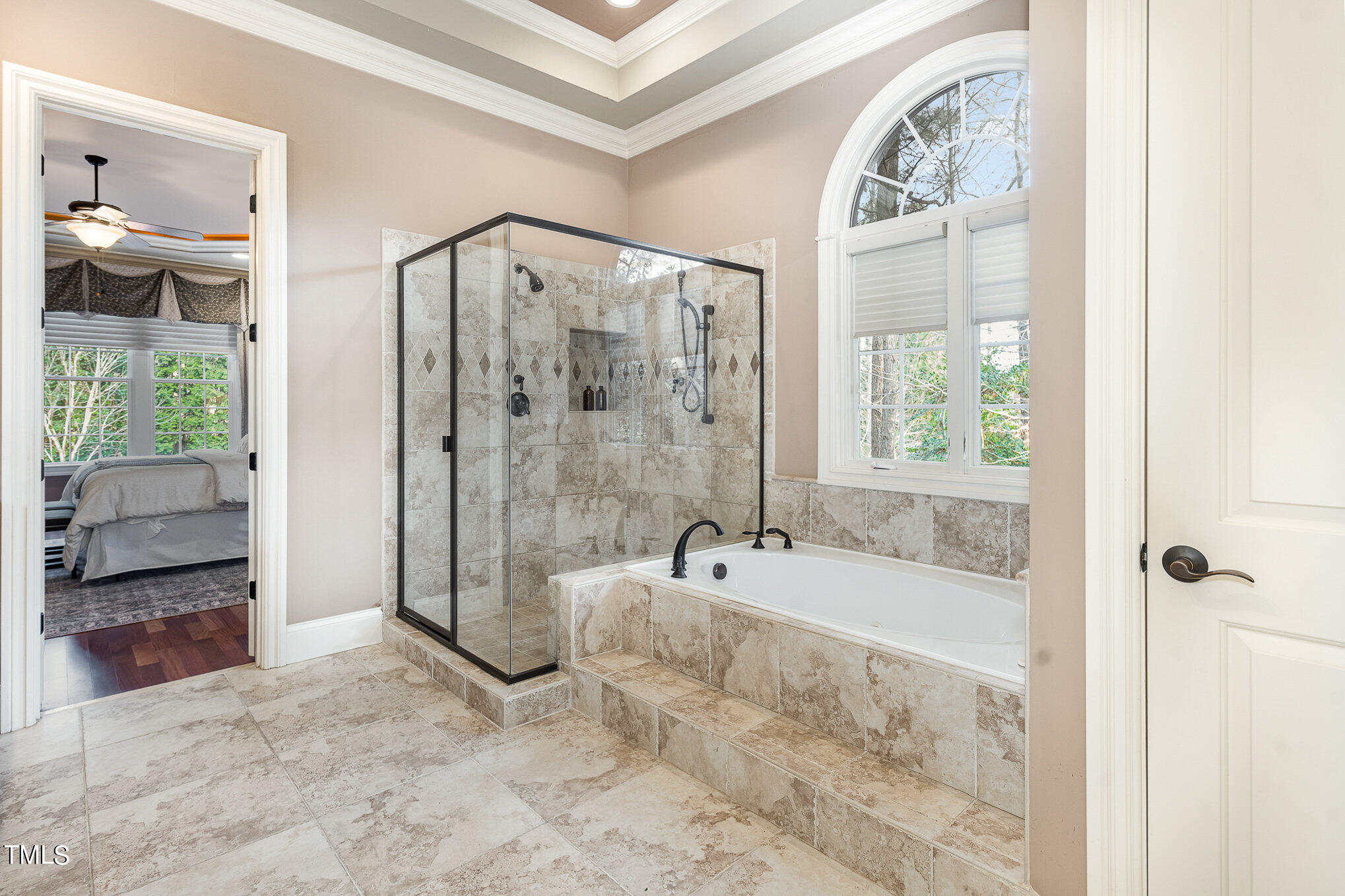 3028 Wyntree Ridge Way Raleigh, NC 27606 - Photo 17 of 39 a spacious bathroom with a tub shower and windows