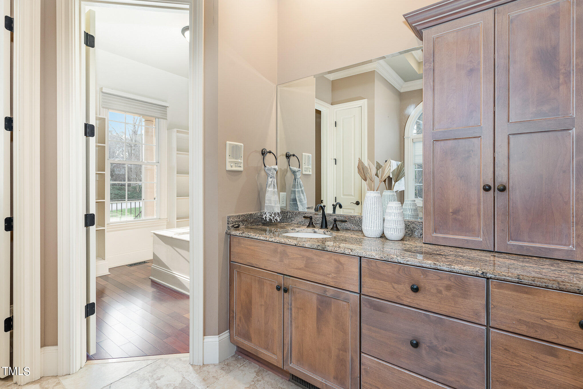 3028 Wyntree Ridge Way Raleigh, NC 27606 - Photo 18 of 39 a en suite bathroom with a granite countertop sink and a mirror